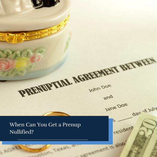 prenuptial agreement document with two gold wedding rings