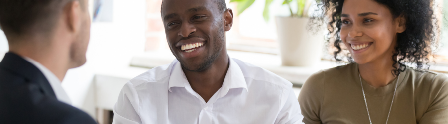 married couple discussing with a postnuptial agreement lawyer