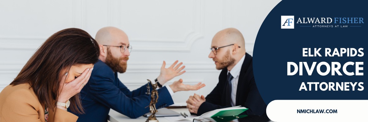 A distressed woman, with her hands on her face, sits at a table while her husband, and an attorney engage in discussion.
